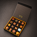 16 Piece Soft Centre Box: sixteen hand-painted soft centres in an open Donarch gift box